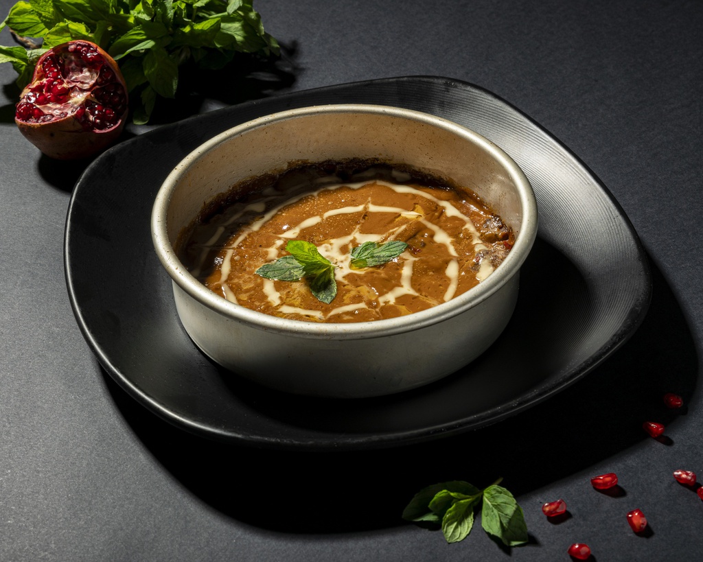 Oven kofta with pomegranate molasses sauce and tahini