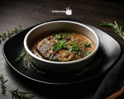 Oven kofta with pomegranate molasses sauce and tahini